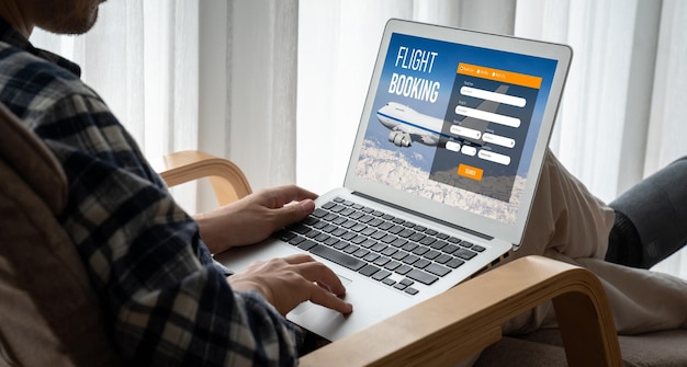 A person using a laptop to compare travel insurance options online, with various browser tabs open showing different insurance company websites.