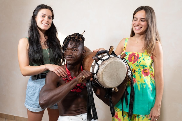 A group of tourists participating in a traditional Brazilian dance with local villagers in a rural community. The image captures the joyful interaction and cultural exchange between visitors and locals.