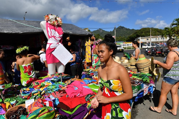 A crowded street market in Salvador, Bahia, Brazil, showing vendors selling colorful textiles, crafts, and food items, with a focus on the vibrant atmosphere and cultural richness.