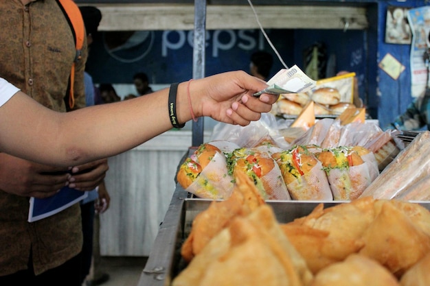 A bustling street food market in São Paulo, Brazil, with a variety of stalls selling local delicacies such as pastel, coxinha, and brigadeiro, highlighting the diversity of Brazilian cuisine.