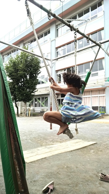A vibrant photo of a diverse group of Brazilian children of different ethnic backgrounds playing together in a schoolyard.