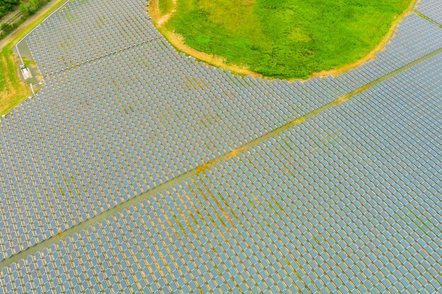 Aerial view of solar panels in a field. Concept of clean energy, green energy, renewable energy, alternative energy. Solar farm in sunny day.