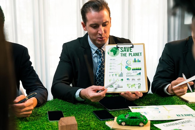 Business people analyzing data charts and reports showing investment trends. Investment in renewable energy, sustainable development concept.