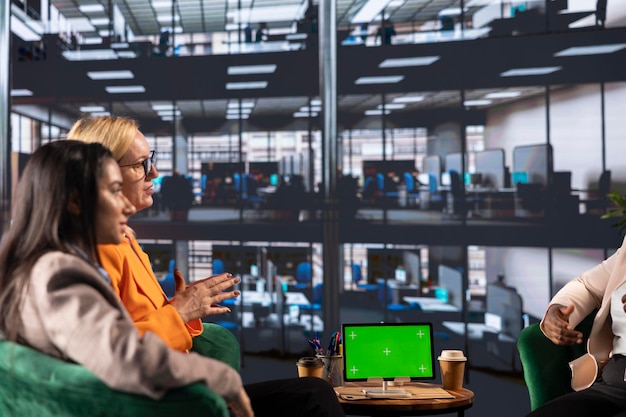 A modern office space with developers working on computers, highlighting the high demand for tech professionals in Brazil. The atmosphere should be collaborative and innovative.