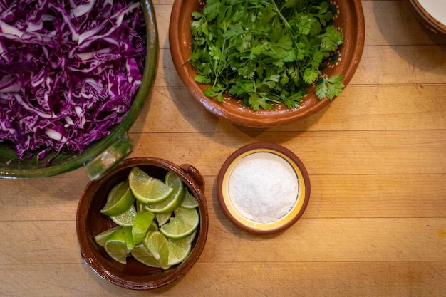 Close-up shot of raw ingredients for a traditional Brazilian dish, side-by-side with cheaper substitution alternatives, highlighting the visual differences and similarities in texture and color. For exemple: olive oil and soybean oil.