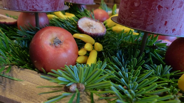 A close-up shot of a farmer's market stall overflowing with seasonal fruits and vegetables in Brazil. The vibrant colors of the produce stand out, and a blurred background shows other shoppers browsing the market. Focus is on the freshness and variety of the ingredients.