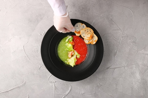 A top-down detailed shot of a chef's hands delicately assembling a healthy version of a traditional Brazilian street food, such as a lightened-up version of a pastel or a tapioca crepe with nutritious fillings.