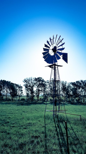 A collage of images representing high-growth sectors in Brazil, including wind turbines for renewable energy, laptops showcasing technology, and agricultural fields illustrating agribusiness.
