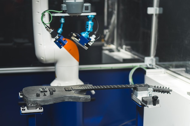 Close-up of a robotic arm assembling components on a production line, highlighting automation and technological advancement in the manufacturing process.