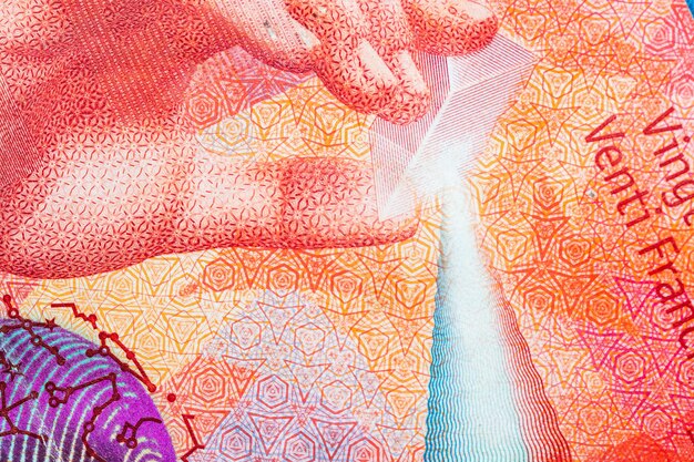A detailed close-up of a Brazilian Real banknote, emphasizing the intricate designs and security features. The focus is on the denomination number and the texture of the paper.