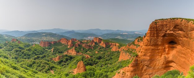 A panoramic view of Chapada Diamantina, showing the vast landscape of canyons, mesas, and lush vegetation. The scene should capture the grandeur and natural beauty of the region, with emphasis on the unique geological formations.
